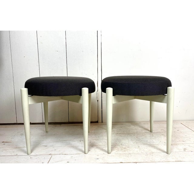 Pair of mid-century Scandinavian wooden stools on round legs, 1950’s We gave them new dark-grey fabric. They will look...