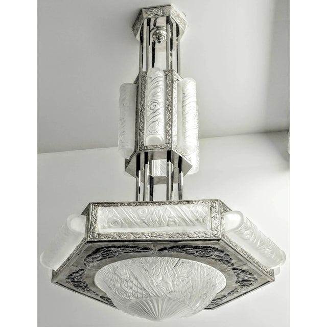 Spectacular grand scale French Art Deco chandelier was created by the French Artist " Schneider " The lower tier is in a...