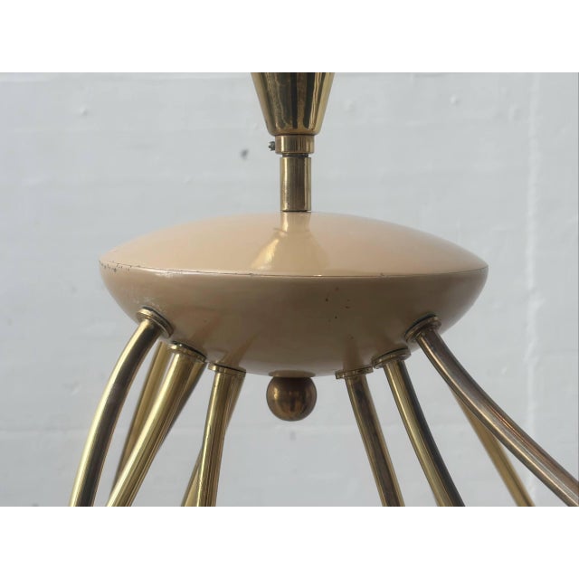 This exceptional vintage spider lamp dates back to the 1950s and features the typical Sputnik or spider lamp design....