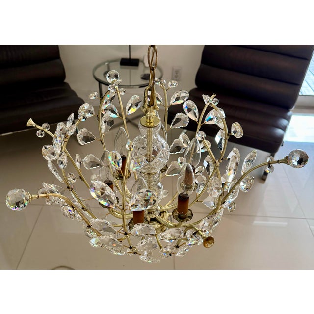 Categorized as French Maison Baguès-style or botanical, this fixture evoke a mid-century modern or "Hollywood Regency"...