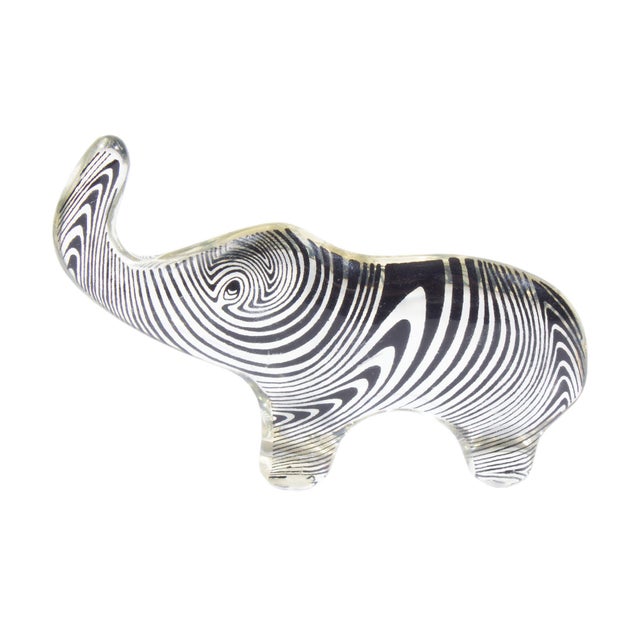 An Op Art lucite elephant designed by the Brazilian artist Abraham Palatnik (1928-2020). This figurine is clear with a...