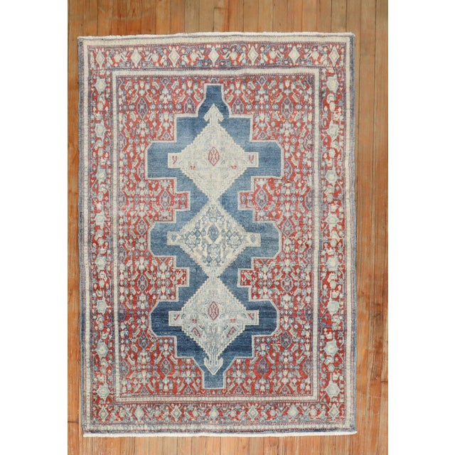 an early 20th century Persian scatter size rug Measures: 3'7" x 4'10" Antique Senneh rugs are one of the most distinctive...