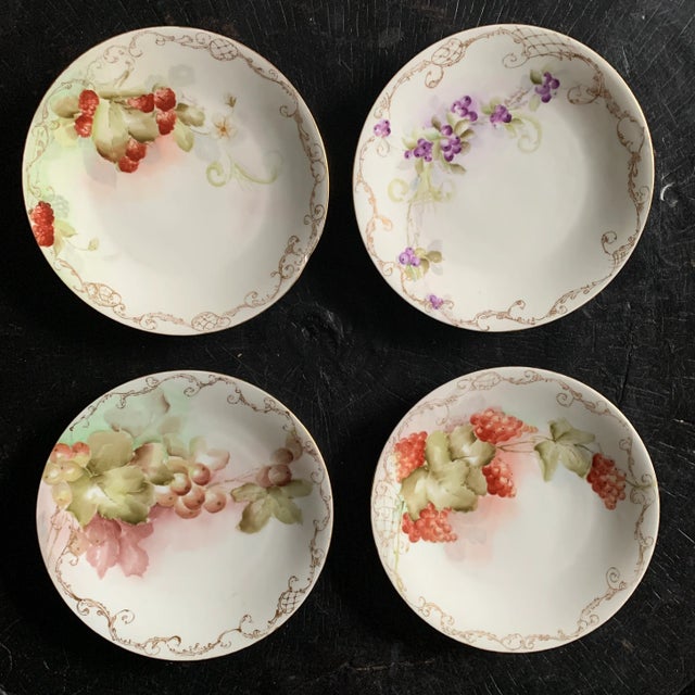 Four beautiful 1904 hand-painted T&V Limoges France plates each depicting different berries with their fauna. Each plate...