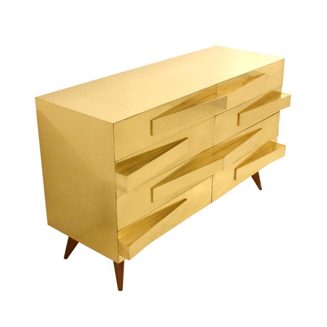 Pair of chests of drawers in Gio Ponti style, with solid oakwood structure from the 1950s, currently covered with brass.