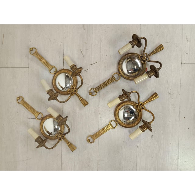 Vintage Bronze Wall Lights by Henri Petitot, 1950s, Set of 4, in Good conditions. Designed 1950 to 1959 This piece has an...