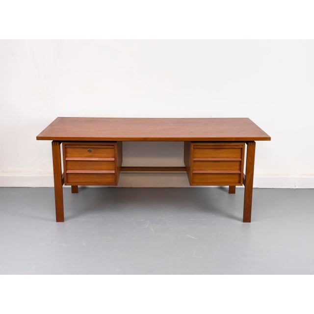 Rare, high-quality desk from Denmark. The design is characterized by a clear, graphic-geometric aesthetic with precise...