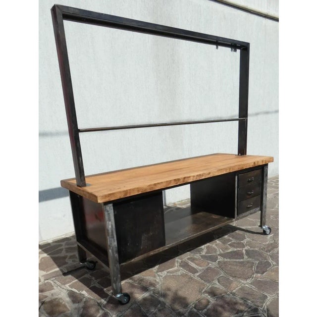 Important industrial island counter, completely restored, with rusty finish and solid blond walnut top. Officina di...