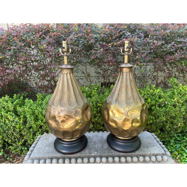 Pair of Italian Modernist Brass Lamps. Offered is a fantastic pair of Italian modern hand hammered brass table lamps....