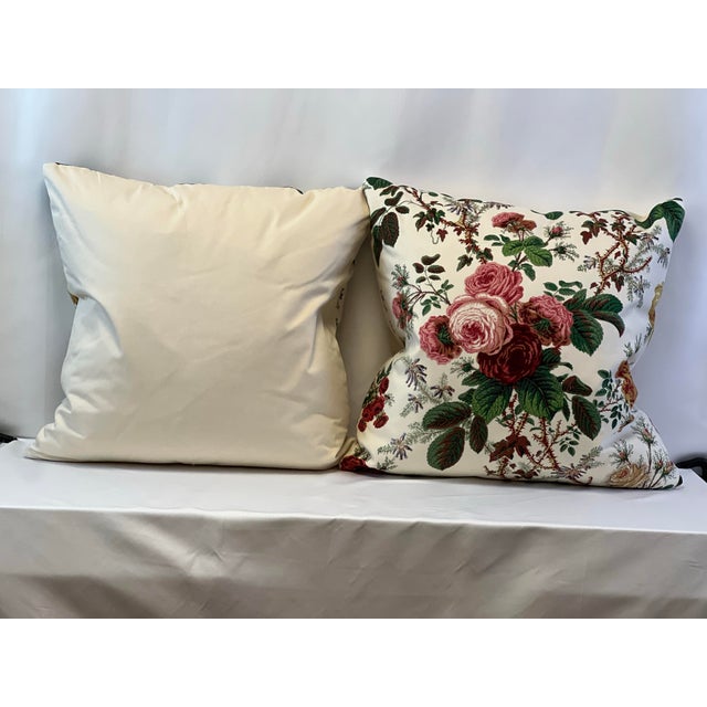 Custom-tailored Floral 22” pillows in shades of rose and burgundy with beautiful dark green foliage. Backs in coordinating...