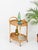 Marvelous mid-century oval bar cart, crafted entirely in curved rattan and bamboo. This stylish organic bar cart was...