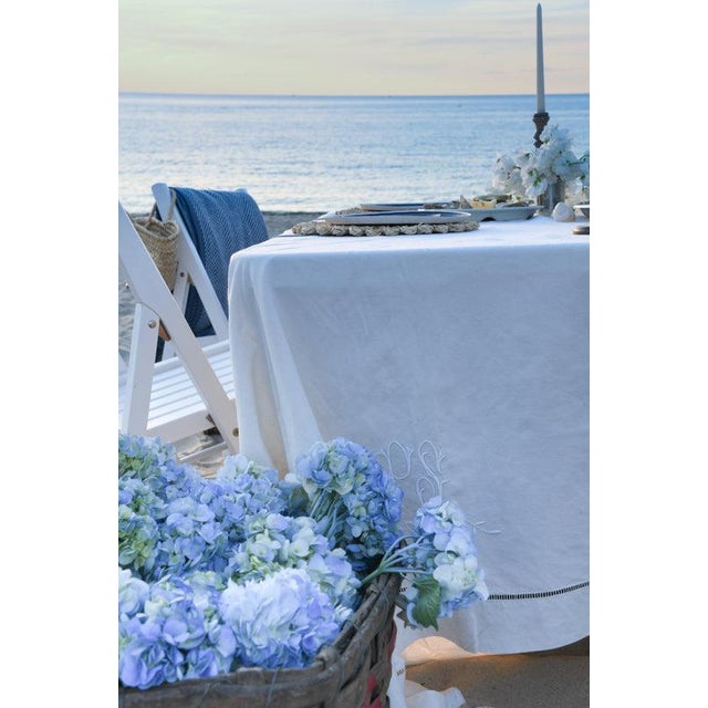 Fine cotton linen in warm ivory, finished with a delicate hemstitch border. Sourced in France, it has softened through...