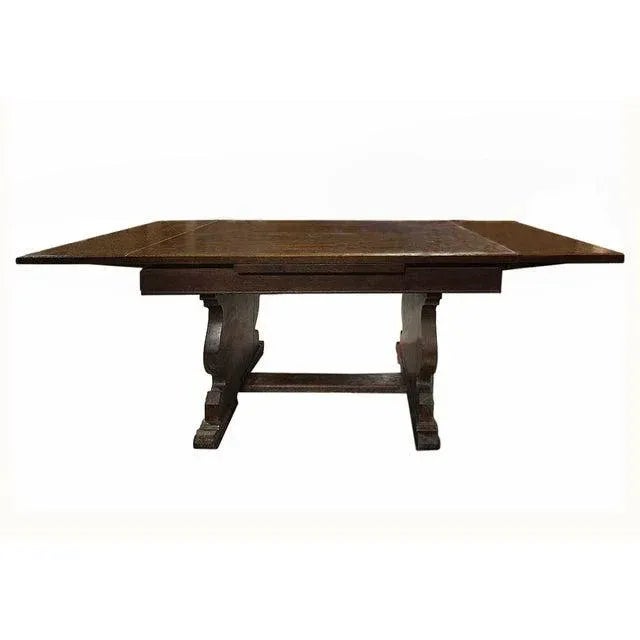 Antique early 20th century wooden library, center hall and dining table. Table is extendable. Leaves slide out from...