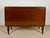 Spanish drop-leaf dining table dating from the 1930s. Crafted in wood, it features two folding leaves that allow it to be...