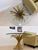 Striking vintage Hollywood Regency coffee table featuring an ornate sculptural wheat sheaf base in a warm gilt gold finish...