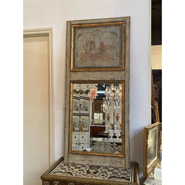 Lovely 19th century French painted Trumeau mirror featuring a painted scene with monkeys. Also note the divided mirror...