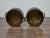 This pair of antique English bushel measures brings a sense of rustic charm and historical authenticity to any space....