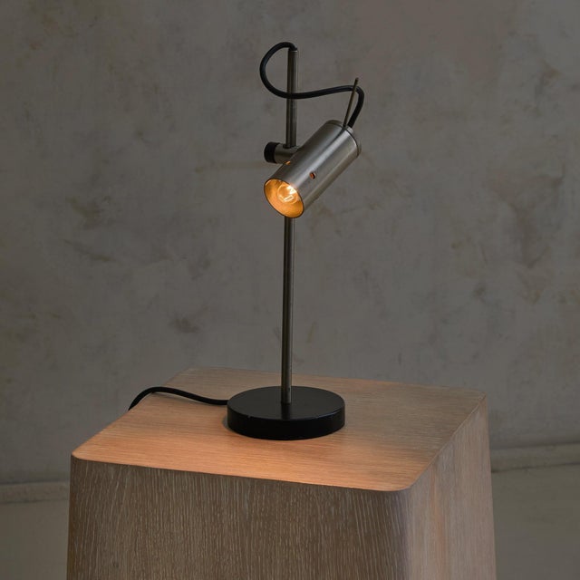The Model 251 table lamp was designed by Tito Agnoli for Oluce in 1955. A rare design, the lamp features a weighted...