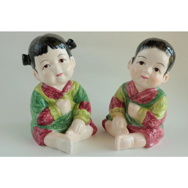 These sweet matching figures have playful poses and finely detailed facial features.