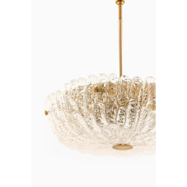 This rare pair of ceiling lamps, designed by carl fagerlund and produced by orrefors in sweden during the 1960s,...