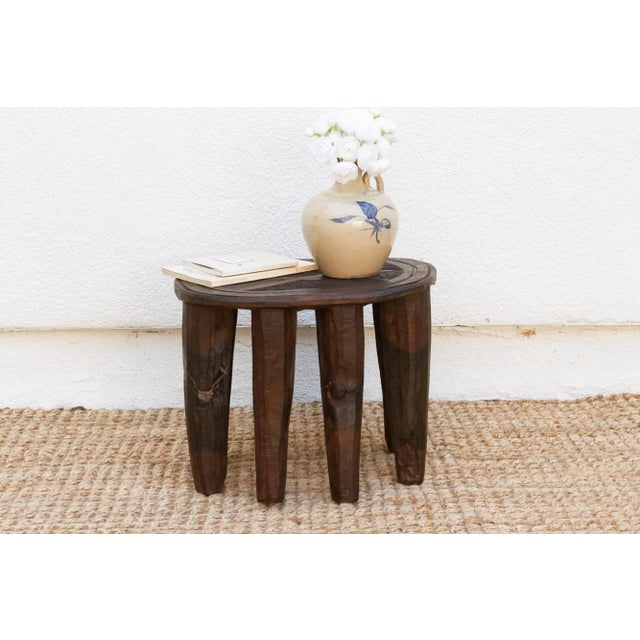 A unique piece of African art, this vintage Nupe table from Nigeria is a must-have for collectors and enthusiasts of Nupe...