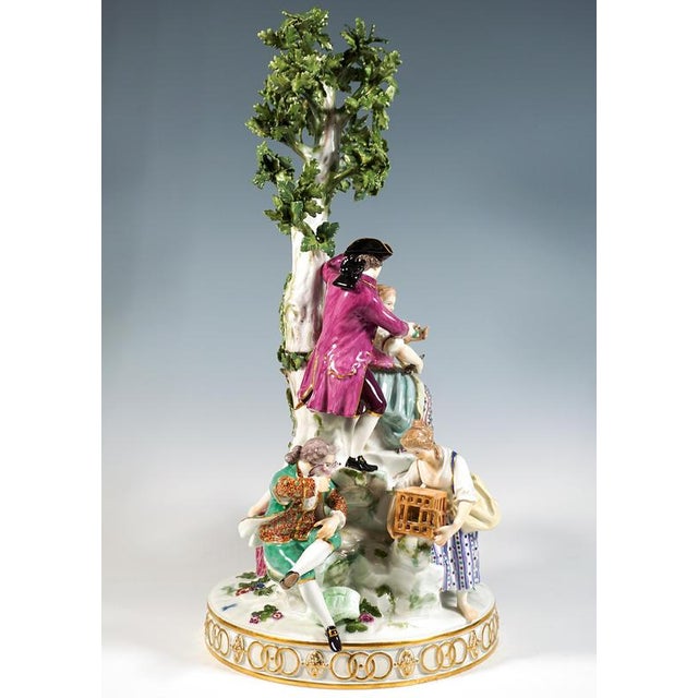 Excellent meissen porcelain group: six gardener figures on a rock around a tree: three gallant couples, one teasing each...