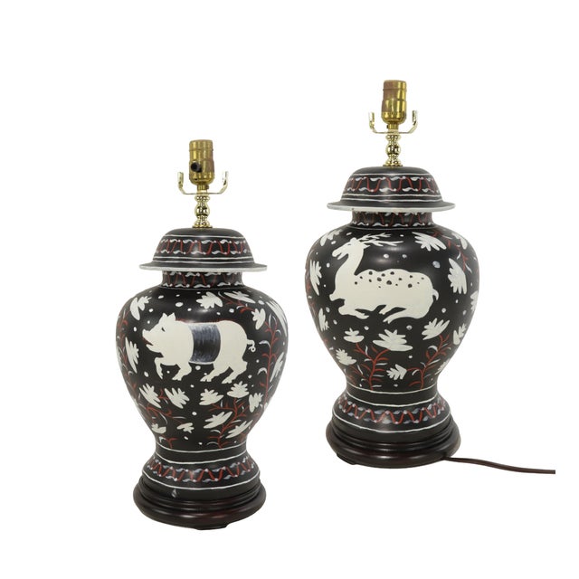 These vintage Brunschwig & Fils Cadiz table lamps feature classic ceramic bodies finished with a classic antique black...