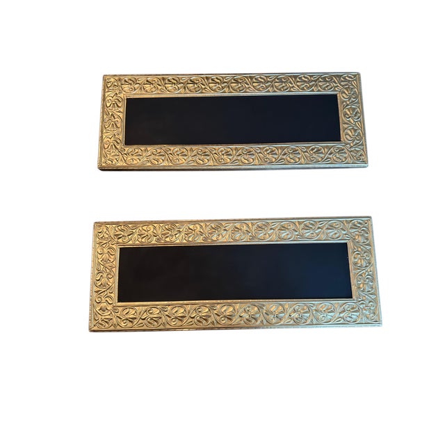 A beautiful and unusual oversized chalkboard framed in richly embossed gold-tone metal/tin, featuring an intricate...