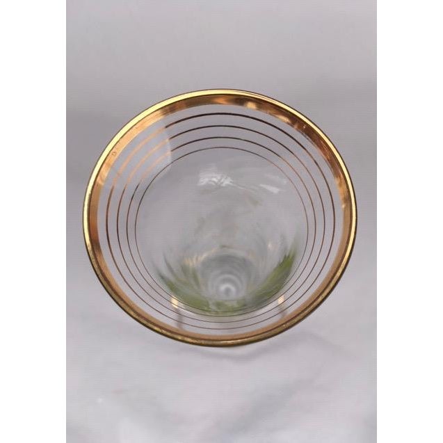 2 glass hand painted bud vases, with gold rim on the top edge and base of the vases.