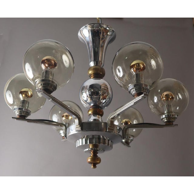 Long length with chain 120cm. Renewed versions and converted to E14 thread. The mouth -blown glass balls are placed on....