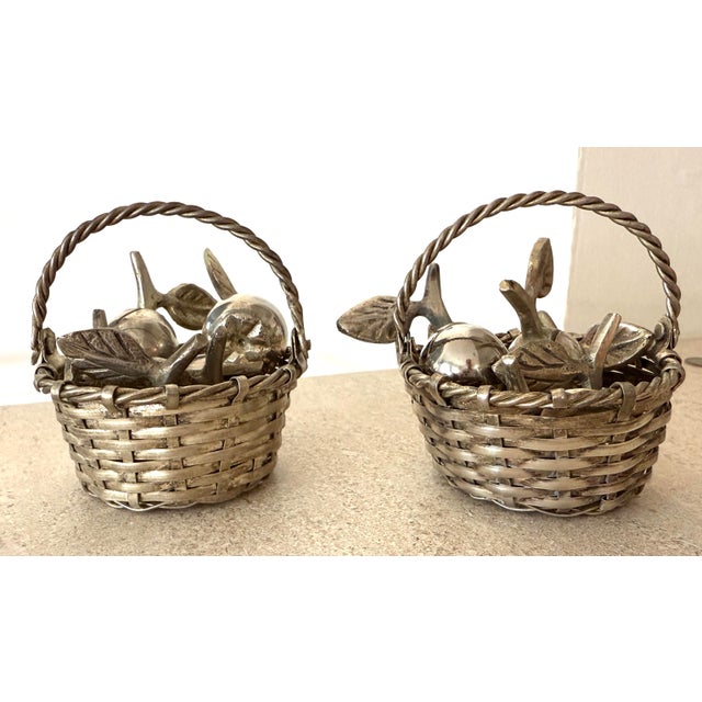 Two silverplate woven baskets with handles. Each holds 6 apple place card holders. 12 apple place card holders in all....