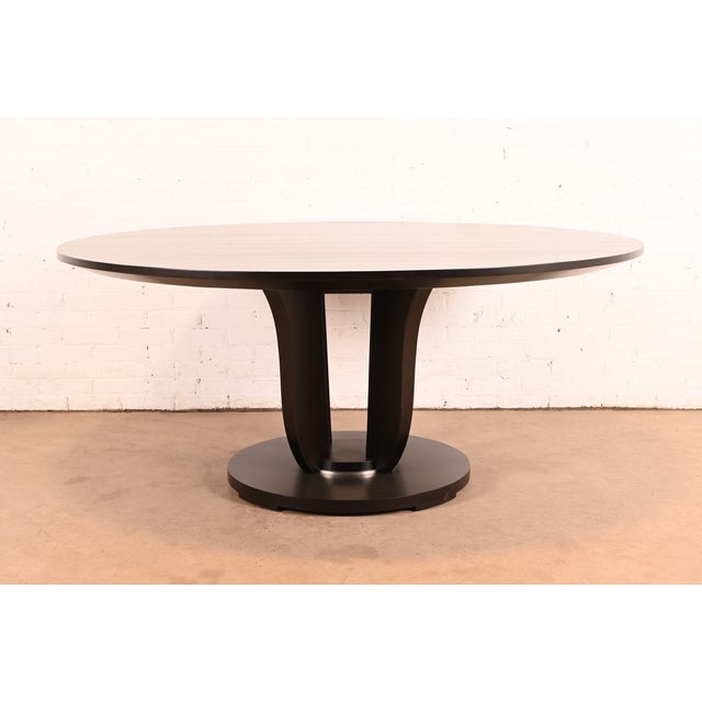 A gorgeous modern Art Deco style dark mahogany round pedestal center table or dining table By Barbara Barry for Baker...