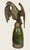 Antique cast gilt bronze eagle flag topper featuring a detailed spread-wing design mounted on a polished green onyx base....