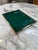 Elegant vintage serving tray featuring a rich emerald green lacquered surface framed by a polished brass border. The clean...