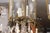 A French hall lantern executed in gilt bronze with etched sunburst glass panels and ornate scrolling crest details. The...