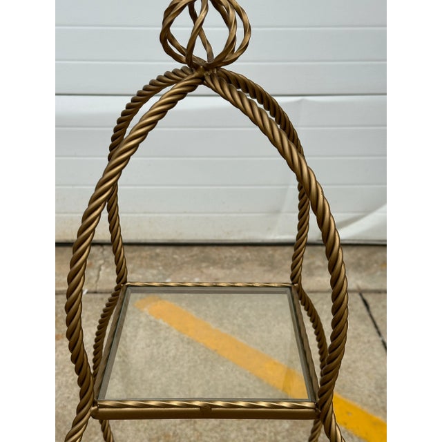 Hollywood Regency 3 Tier gold rope iron etagere. Three glass removable shelves. Circa 1970’s Ideal for boudoir, bath or...