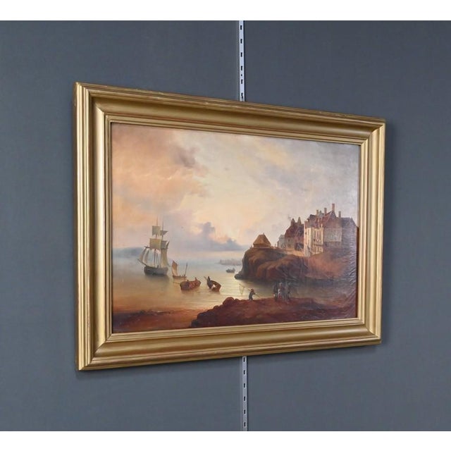 This elegant 19th-century oil on canvas unfolds a maritime scene bathed in a soft, twilight light. On the left, a flotilla...