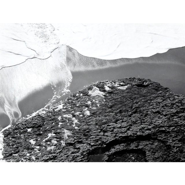 Incoming tide, a black & white abstracted seascape by possibly Jim Deike, signed illegibly lower right. Unframed....