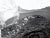 Incoming tide, a black & white abstracted seascape by possibly Jim Deike, signed illegibly lower right. Unframed....