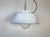 Industrial light grey enamel factory pendant light made in former Czechoslovakia during the 1960s. White enamel inside the...