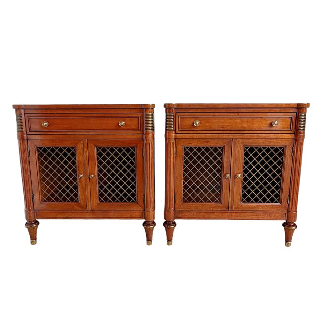 This is a pair of Kindel Furniture cabinets that feature a single drawer over double lattice-front doors opening to...
