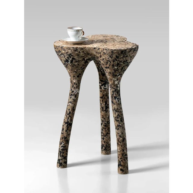 Sculptural concrete tripod low side table in mottled beige by donatas žukauskas a sculptural concrete side table on three...