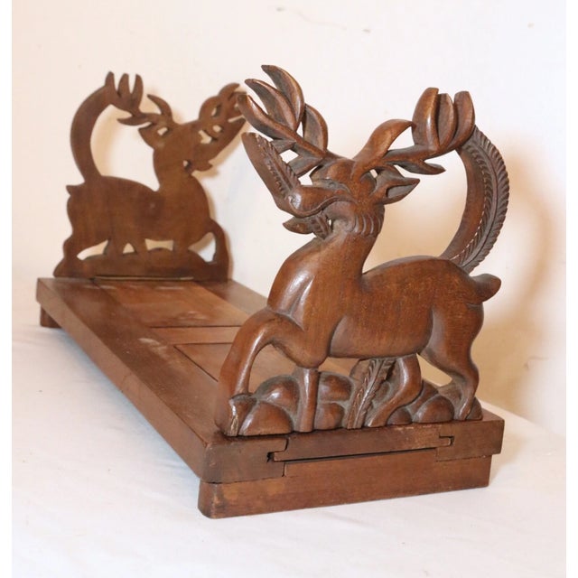 Up for sale is an exquisite antique hand carved wooden adjustable book shelf. The ends are sculpted out of thick pieces of...