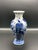 Showcasing the artistry of Dutch ceramics, this Royal Delft blue hand-painted vase features the iconic peacock design, a...