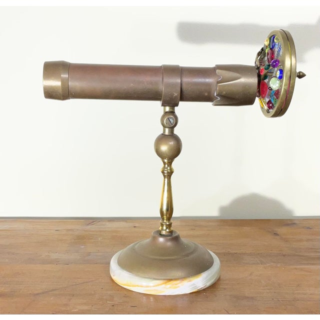 Elevate your collection or home decor with this breathtaking, handcrafted vintage solid brass kaleidoscope. Resting...