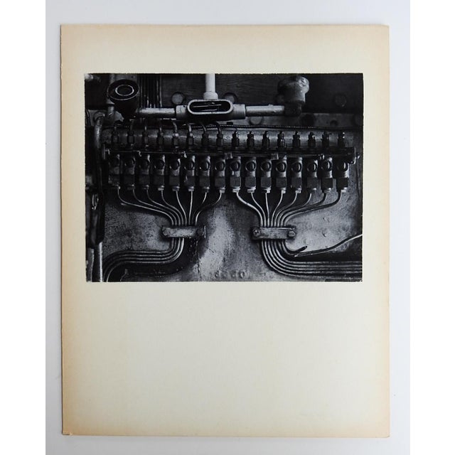 Mid 20th century black and white photograph of industrial machinery. Unsigned. Unframed, mounted on cream cardboard...