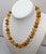 1990s Vintage Signed Givenchy Goldtone Faux-Amber Beaded Necklace For Sale - Image 5 of 9