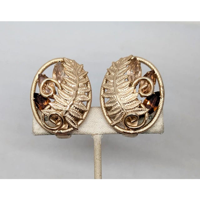 1950s oval goldtone fern with prong set marquise faux-topaz and faux-citrine with a lighter faux-citrine at the top and a...