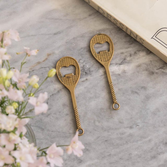 Unique vintage solid brass tennis racket bottle opener from France, 1950s. Beautiful etched brass with intricate details...