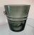 An ice bucket or wine cooler in a gorgeous, heavy, smokey grey glass. Two holding points on the sides allow for a solid...