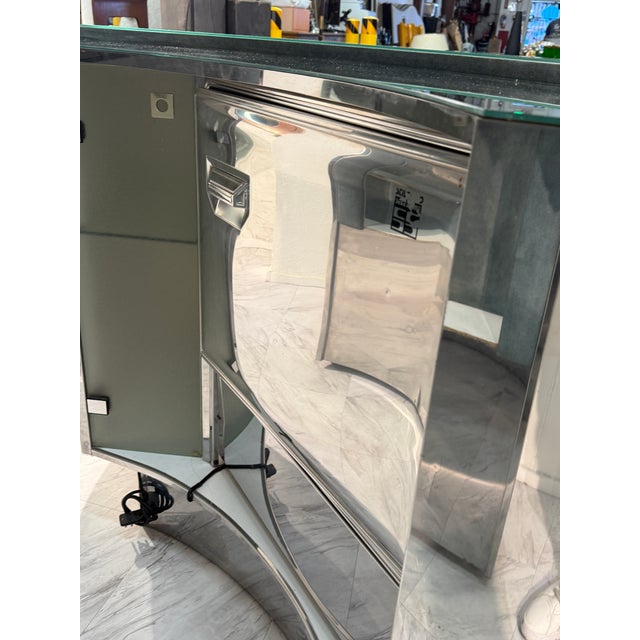 A glamorous Mid-Century Modern bar cabinet with bold sculptural presence, attributed to the design style of Paolo Buffa...